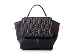 What is the cost for a leather goods manufacturer to make a handbag?